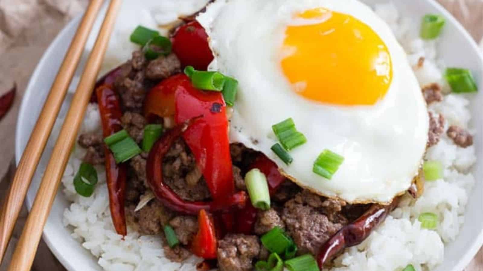 Close-up image of spicy beef and red oeooer rice bowl.