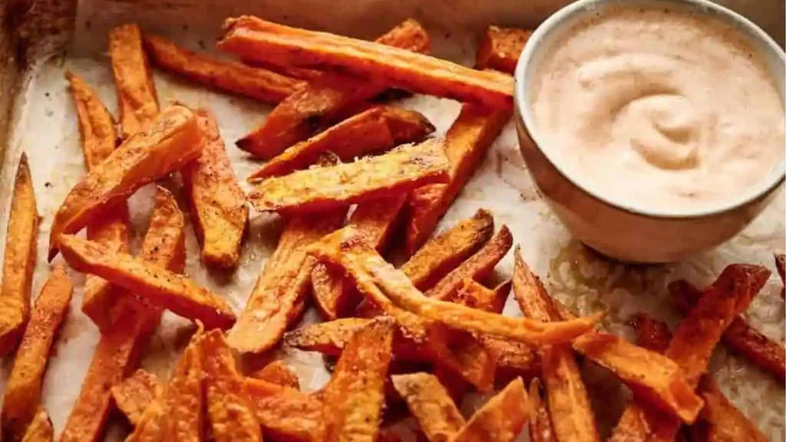 Sweet potato fries with a dipping sauce.