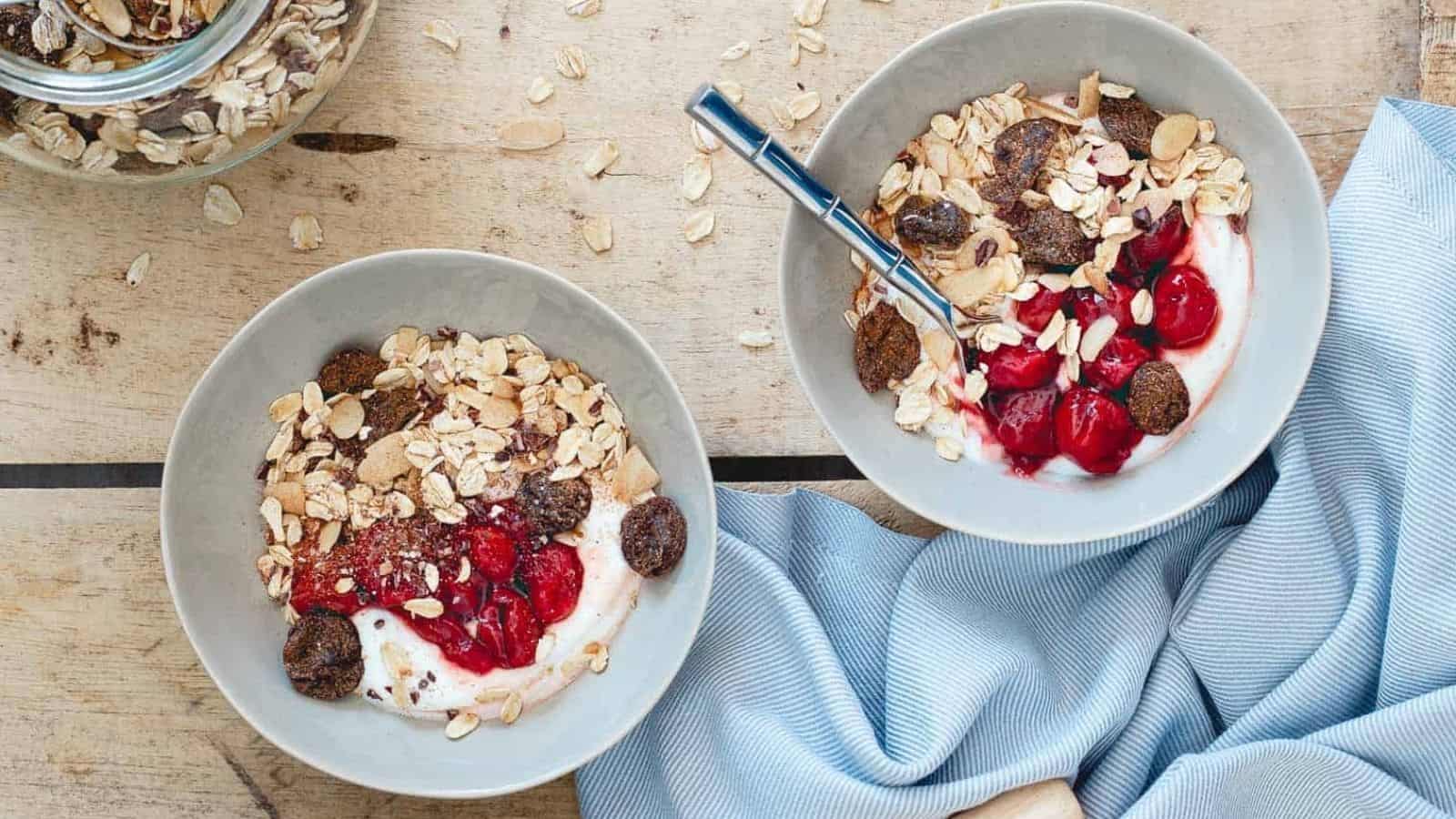 Ovrhead image of two tart cherry ginger muesli yogurt bowls.