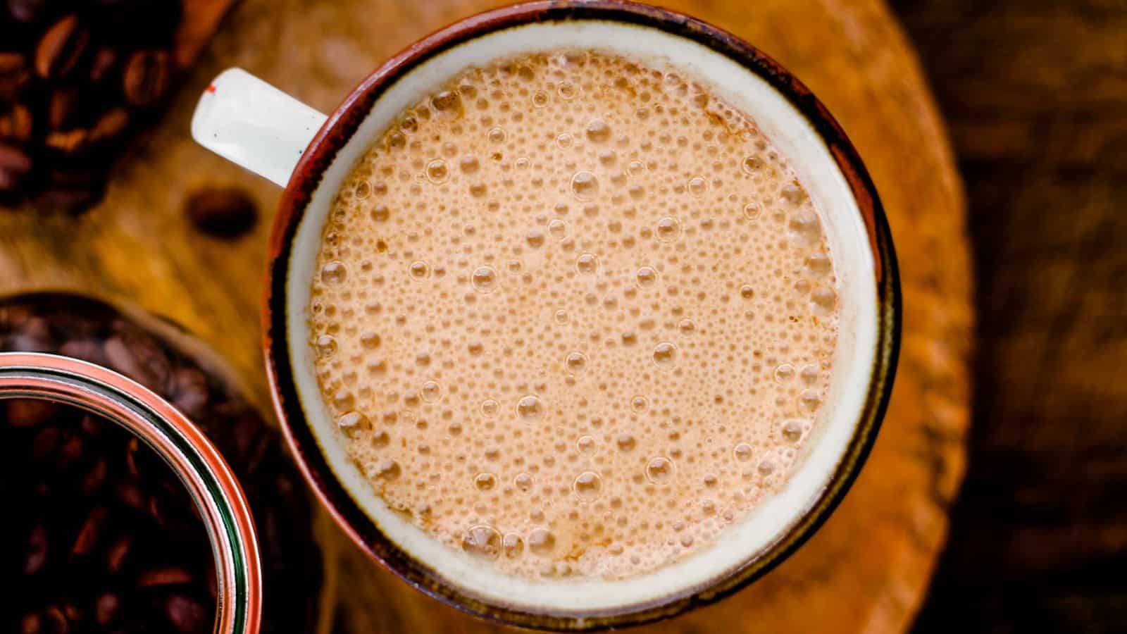 Vegan Bulletproof Coffee being poured into a mug.