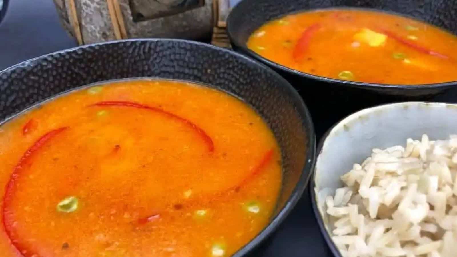 Two bowls of vegan thai coconut curry soup.