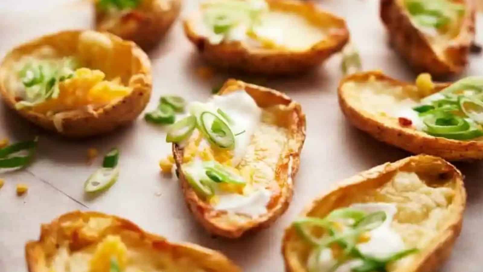 Several vegetarian potato skins on a brown surface.