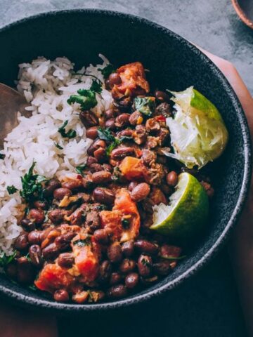 Someone holding a bowl of Adzuki Bean Coconut Curry.