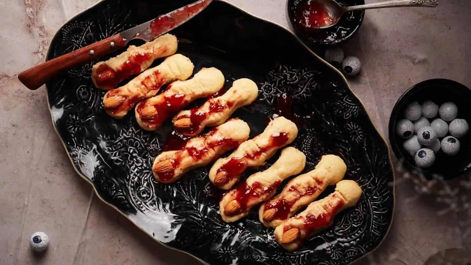 A plate of Creepy Halloween Witch Finger Cookies.