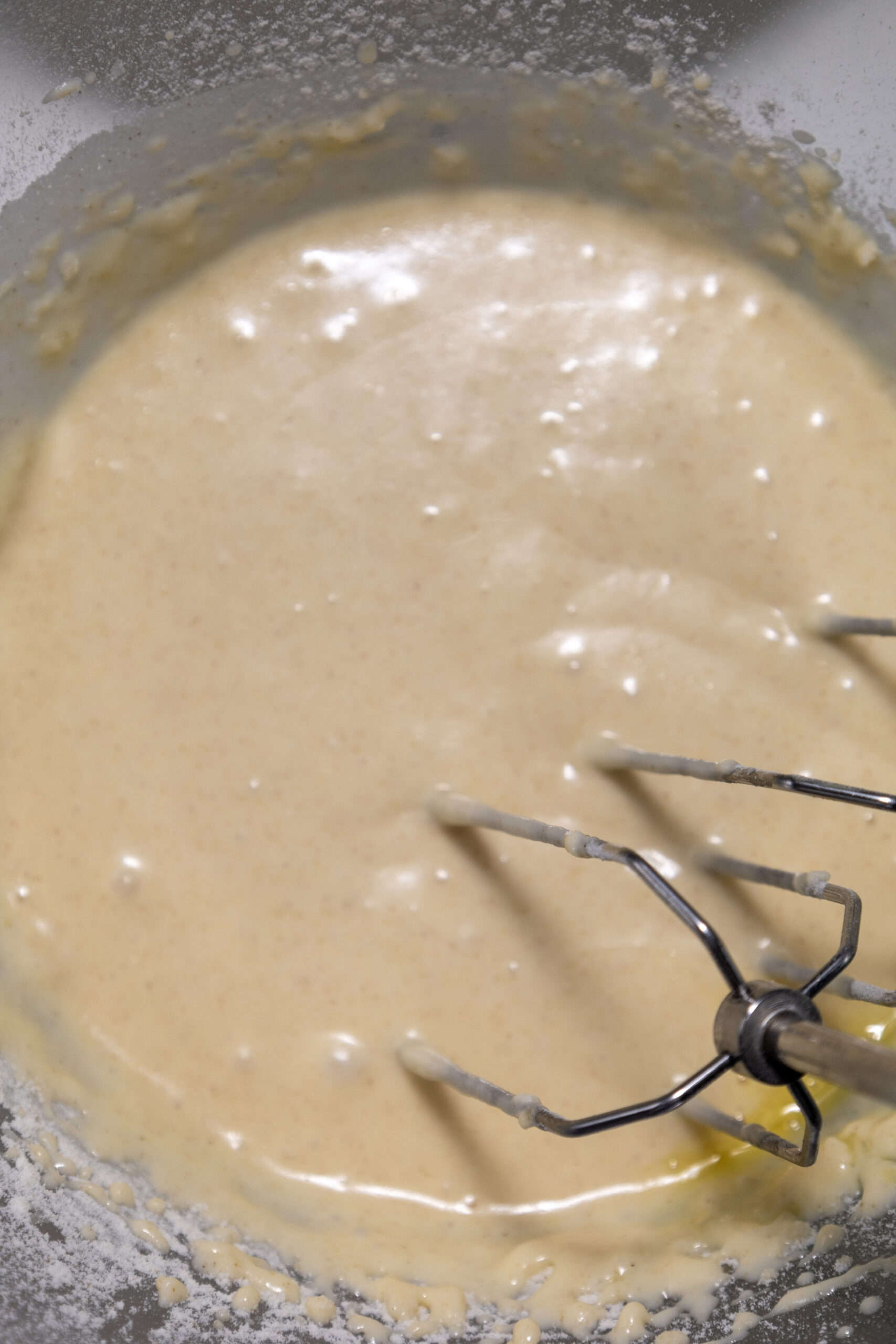 Close-up image of pancake batter in a mixing bowl.