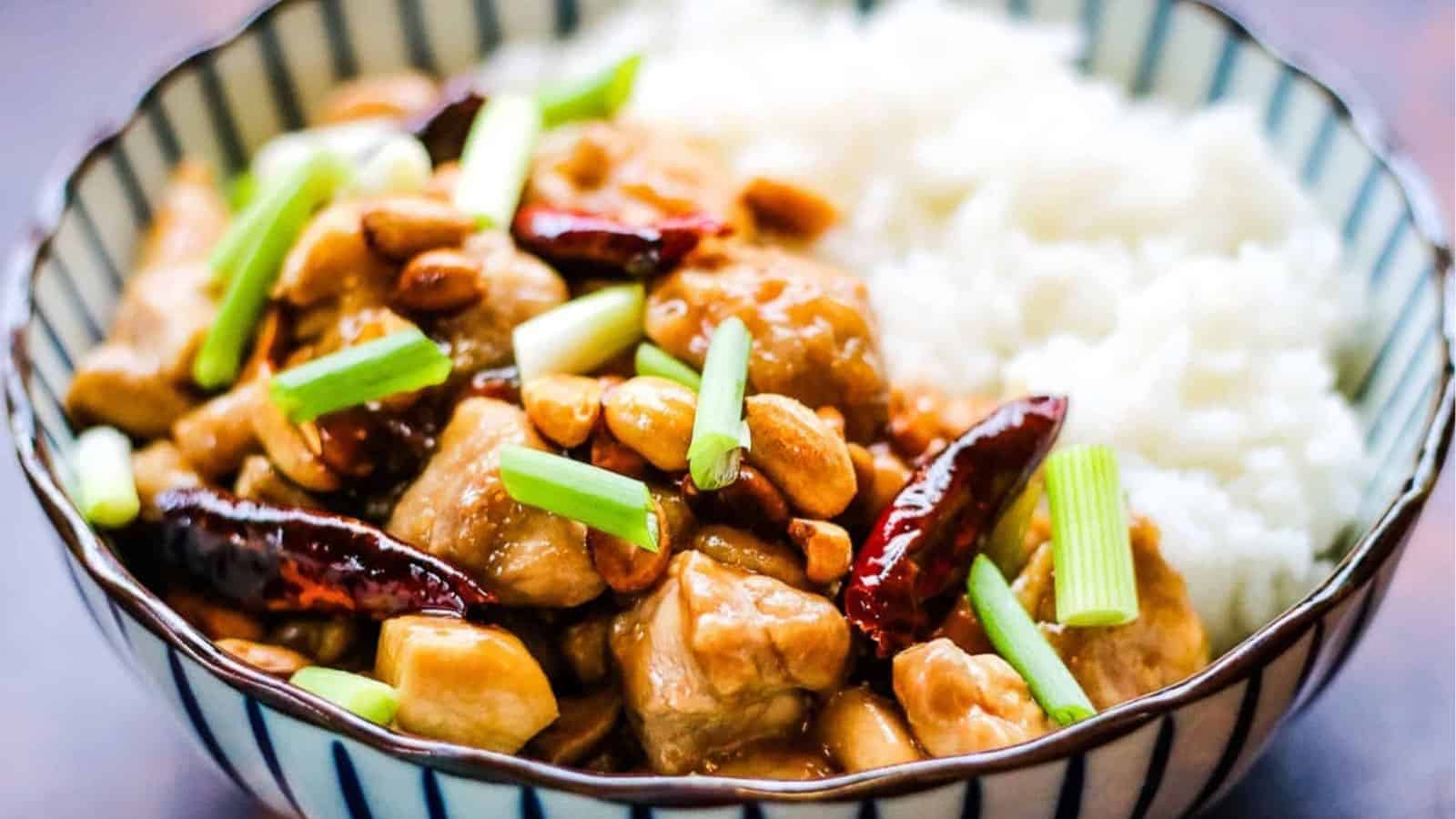 Low angle shot of a bowl of kung pao chicken.