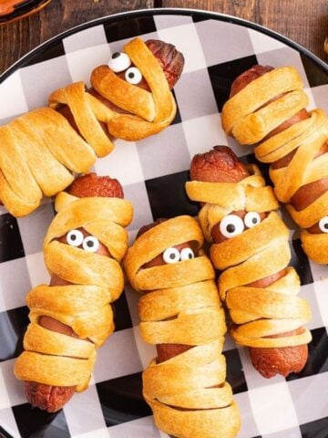 A plate of Mummy Halloween Hot Dogs.