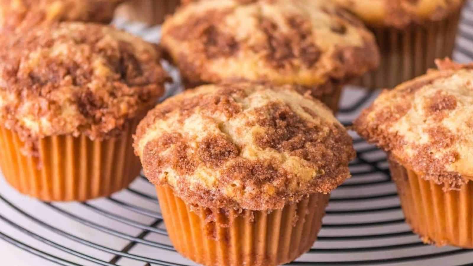 Close-up image of snickerdoodle muffins on a cooling rack.