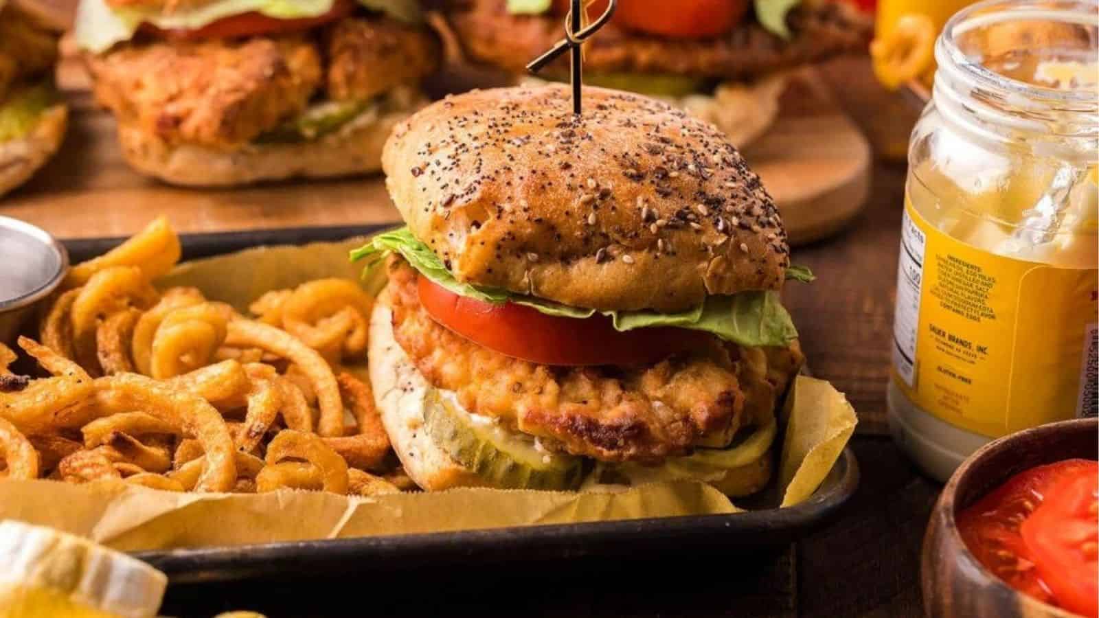 Fried chicken sandwich with fries on a tray.