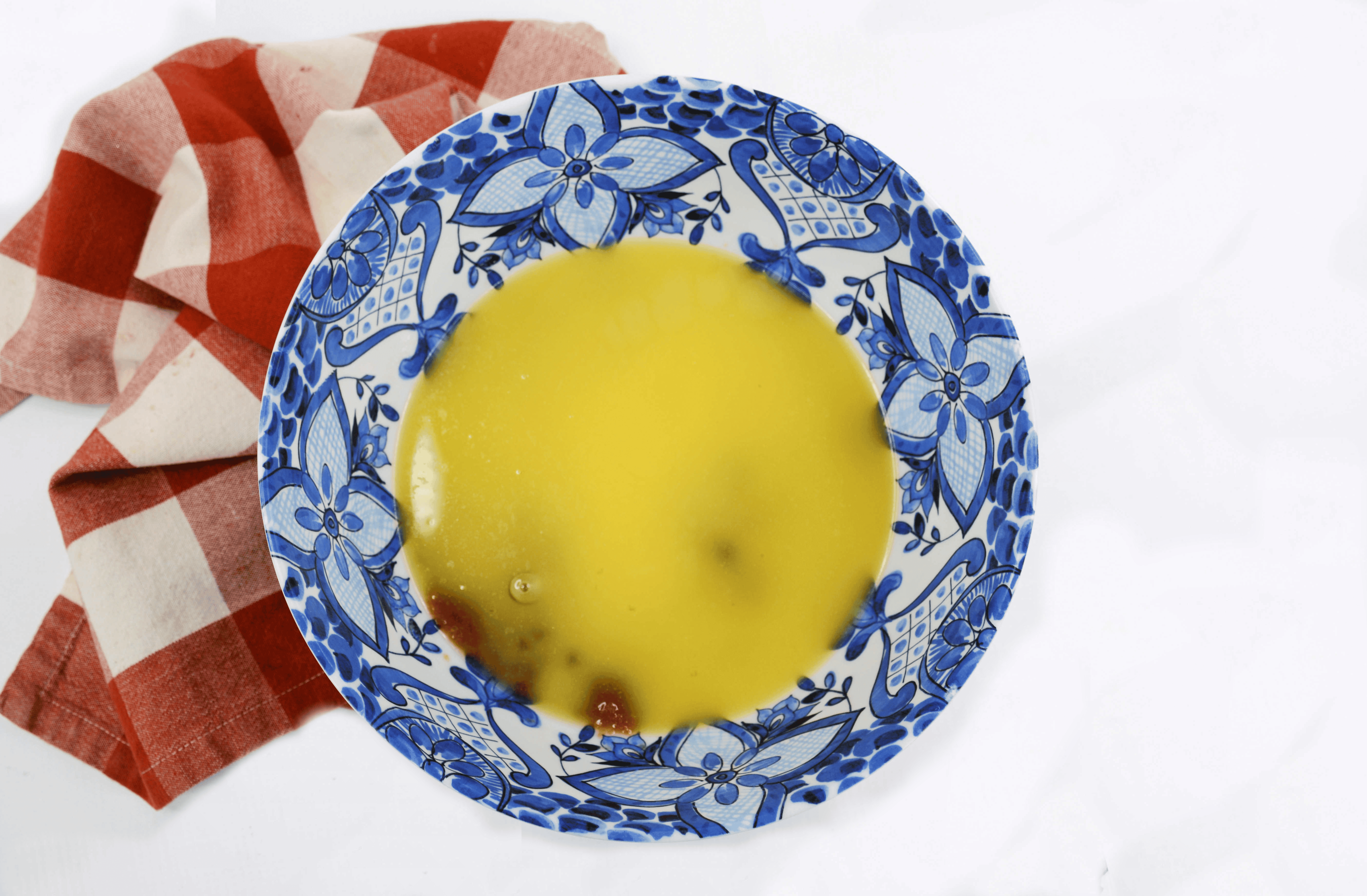 Overhead image of beaten butter and sugar in a bowl.