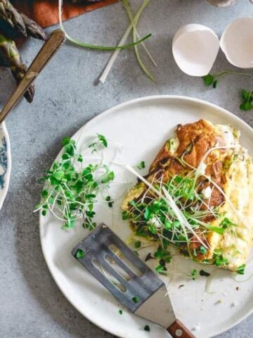 Plates with Asparagus Omelette Souffle.