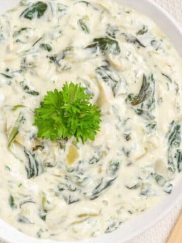 Overhead mage of instant pot spinach artichoke dip in a bowl.