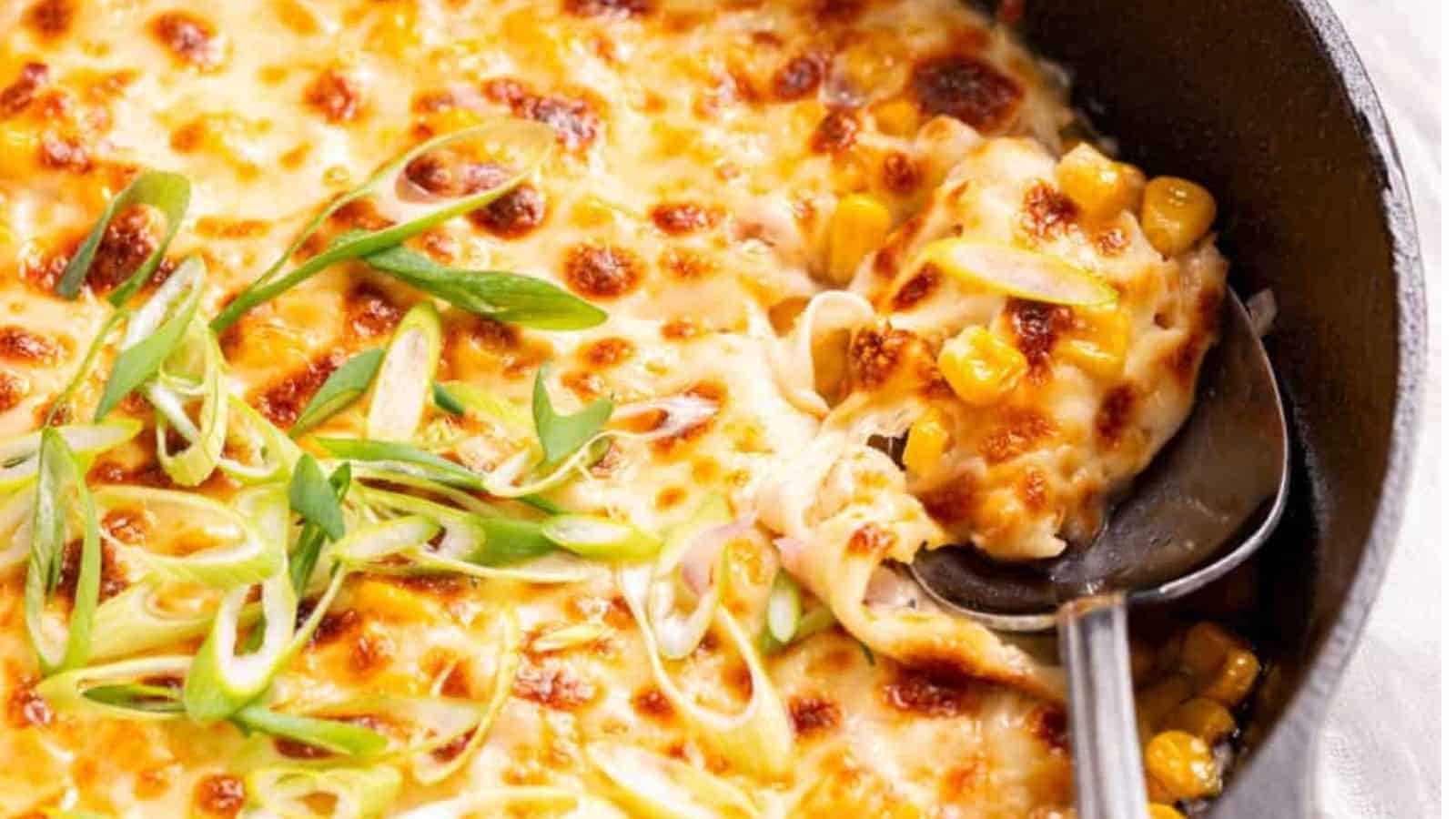 Close-up image of a spoon scooping a full of korean corn cheese.