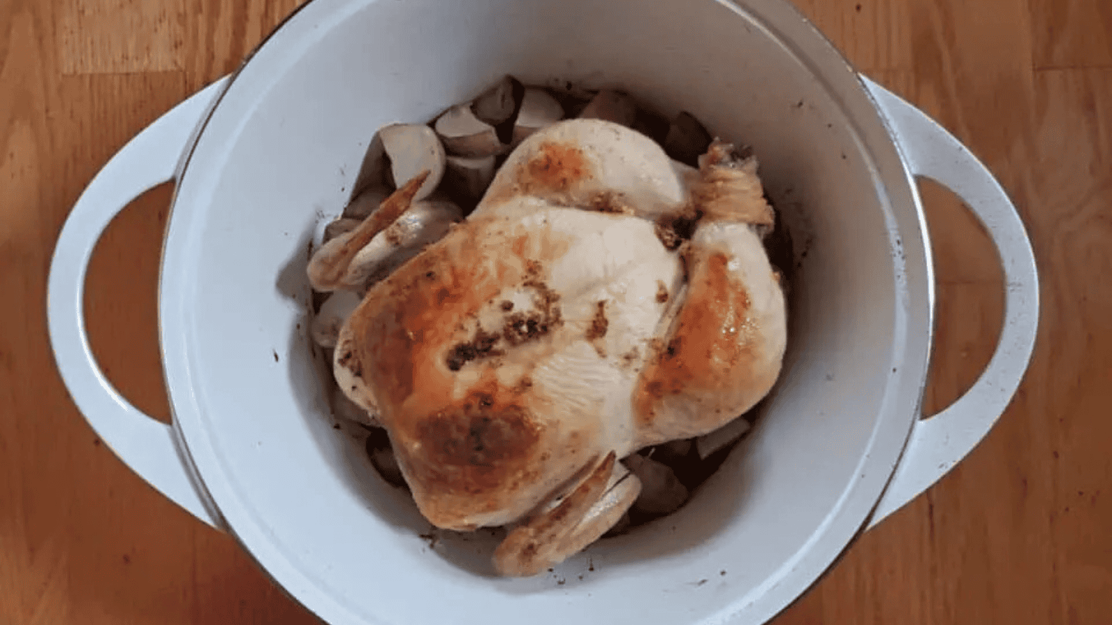 Lime marinated grilled chicken sliced on a red plate over rice.