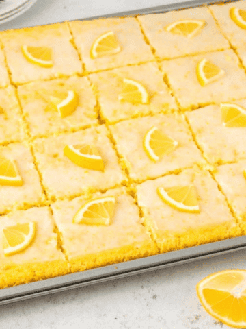 Lemon Sheet Cake topped with lemon slices.