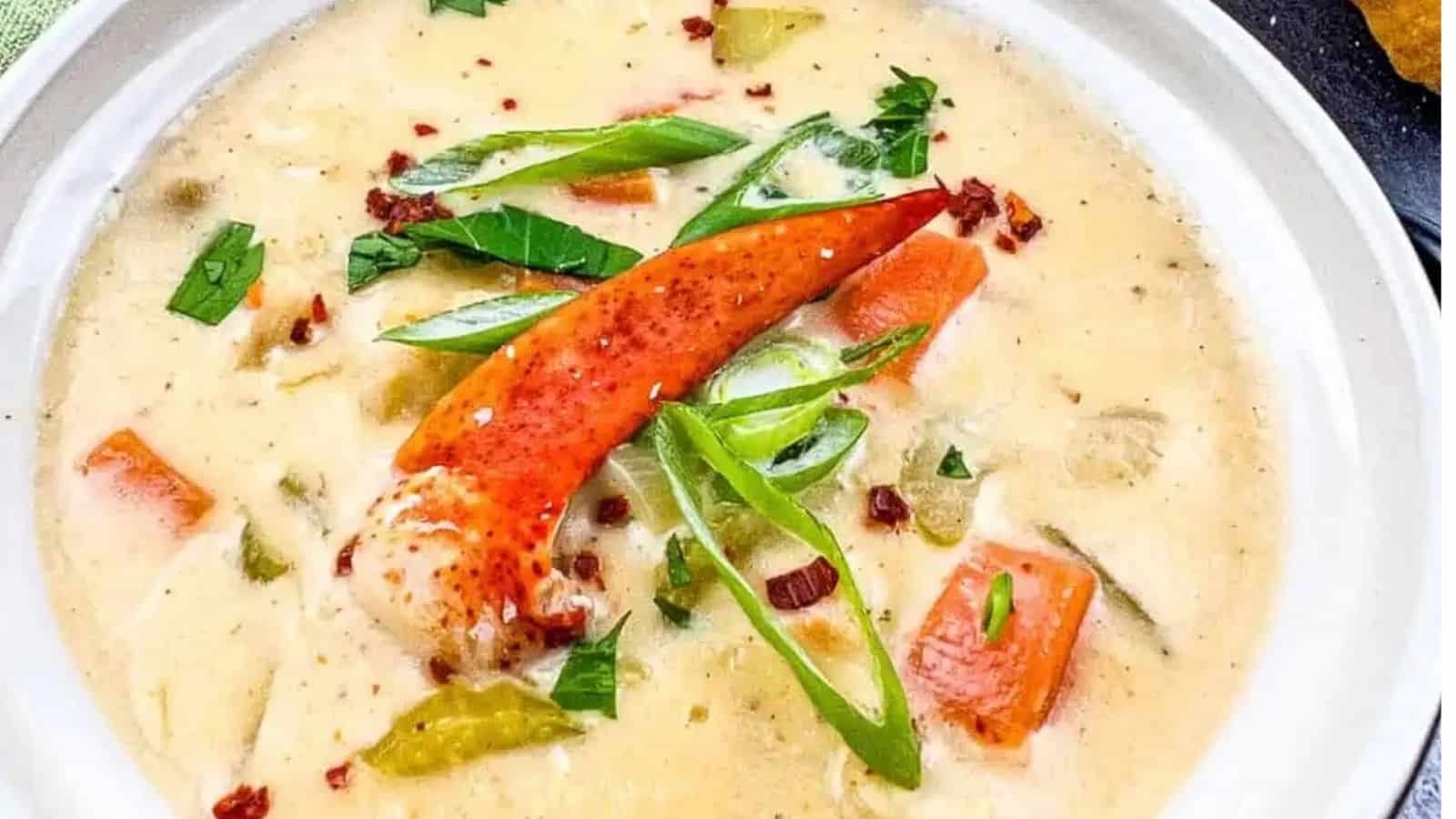 Close-up image of lobster chowder in a bowl.