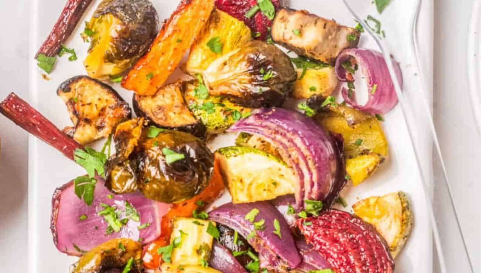 Close-up of an overhead image of roasted vegetable salad on a serving dish.