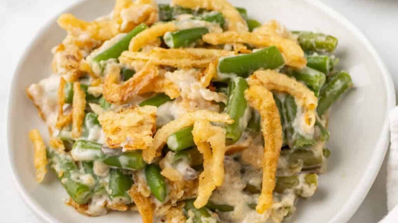 Close-up image of slow cooker green bean casserole on a plate.