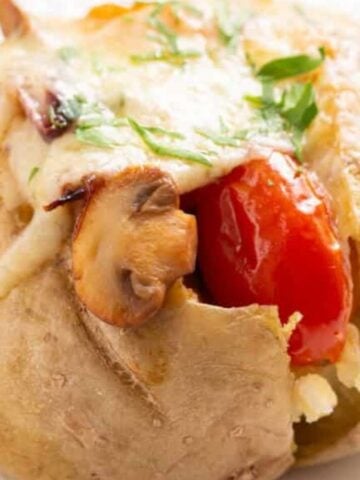 A close-up image of stuffed baked potatoes.