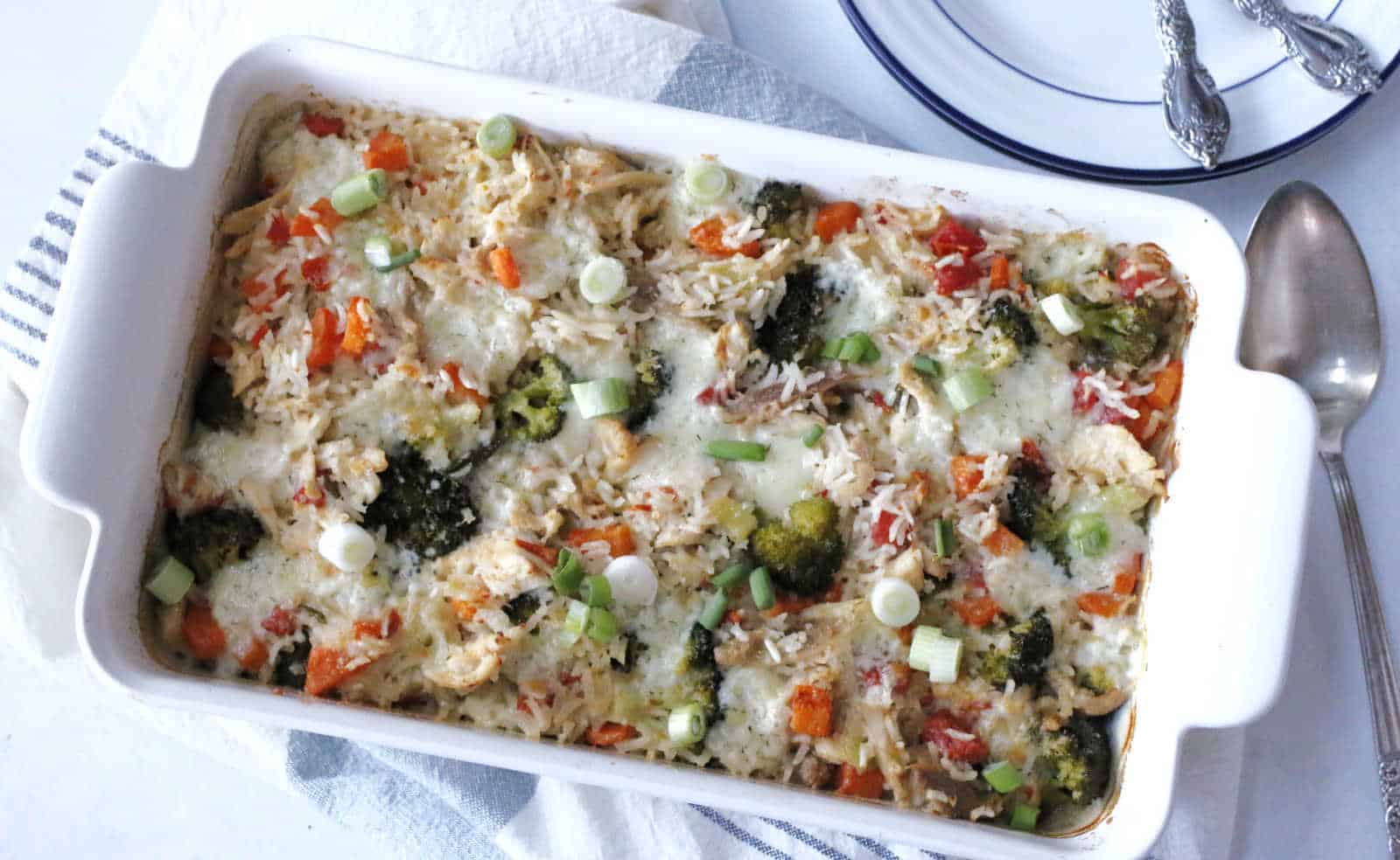 A casserole dish filled with vegetables and cheese.