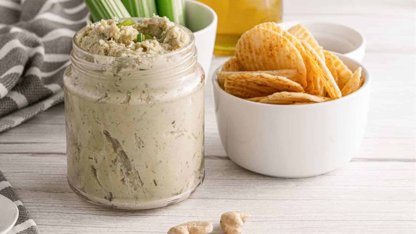 Vegan cashew cheese spread in a glass jar.