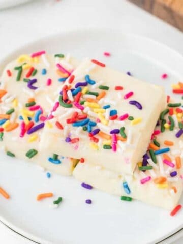 An image of white chocolate fudge on a plate.