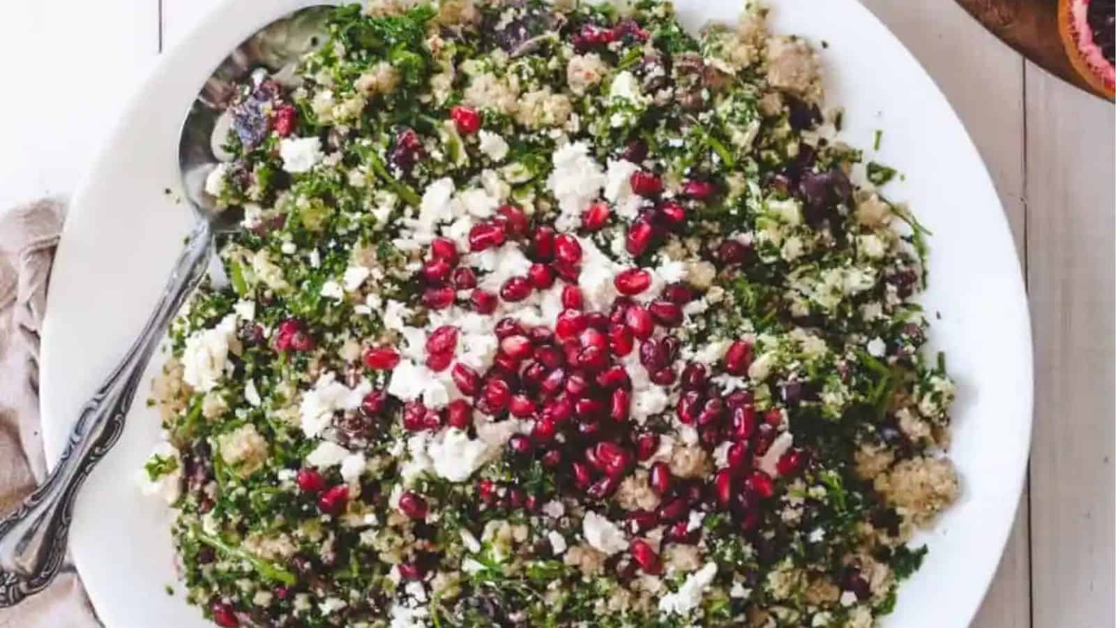 Close-up image of bulgur salad with feta blood orange pomegranate and herbs.