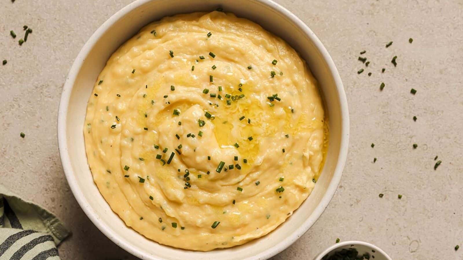 A bowl of Cheddar and Chive Mashed Potatoes.