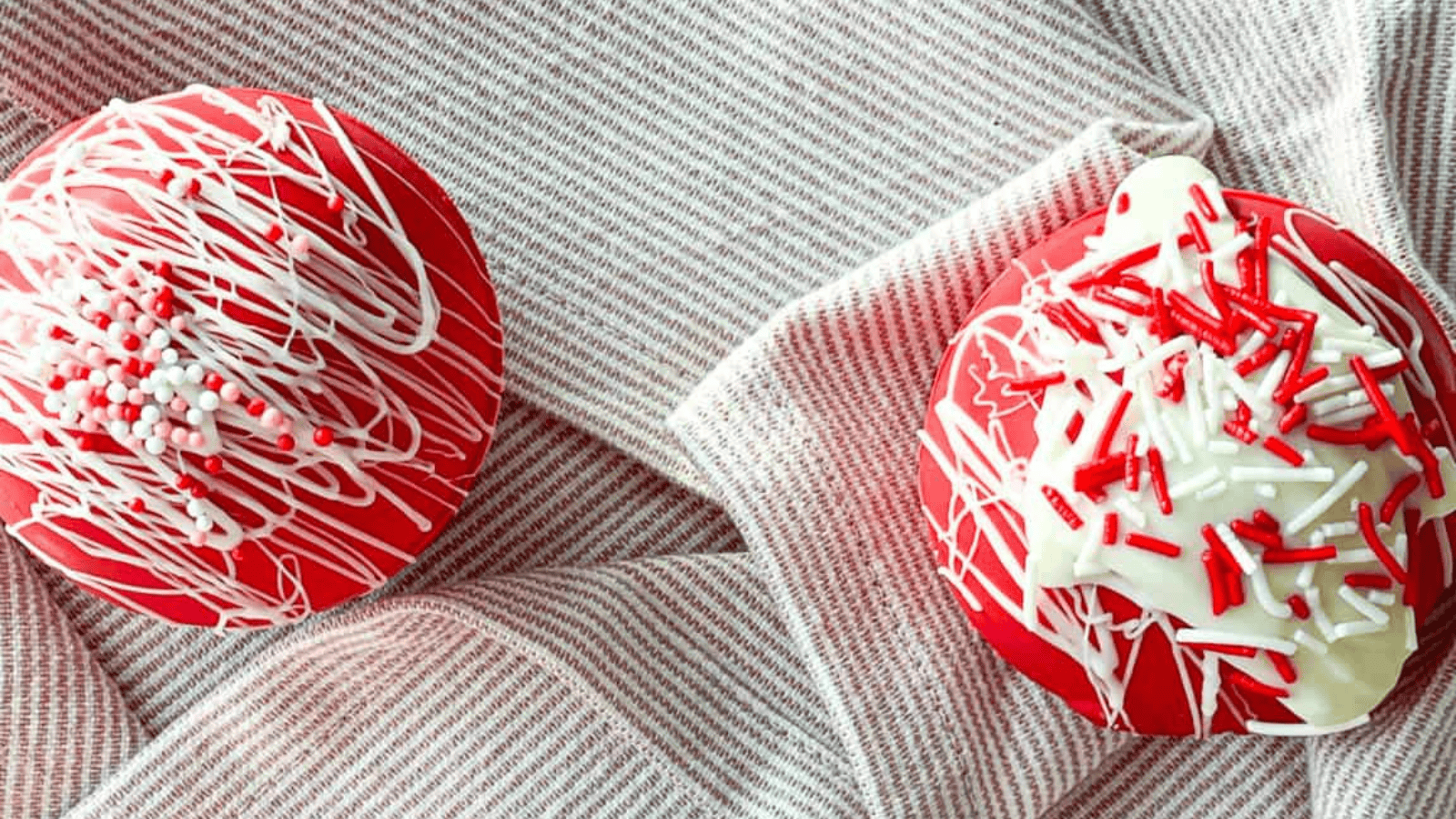 Red Velvet Hot Cocoa Bombs next to each other.