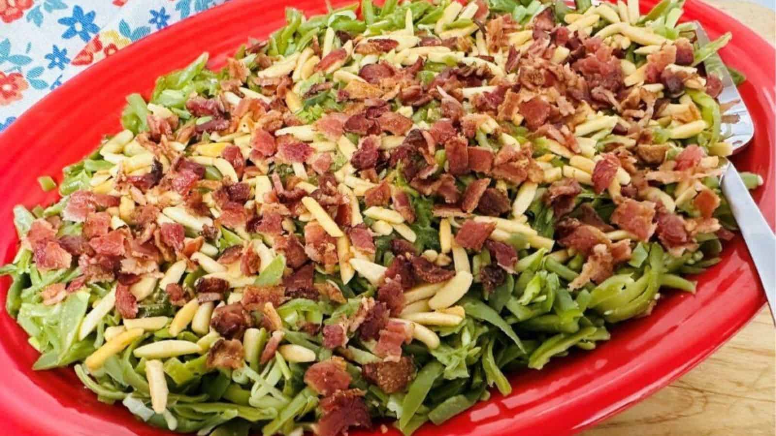 Close-up image of green beans almondine with bacons.