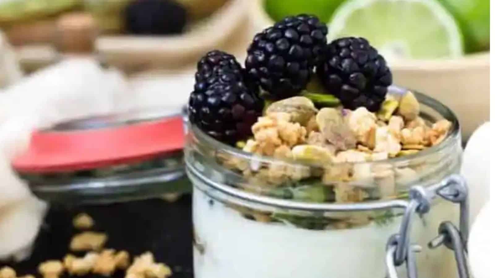 Close-up image of kiwi limi and blackberry yogurt parfait.