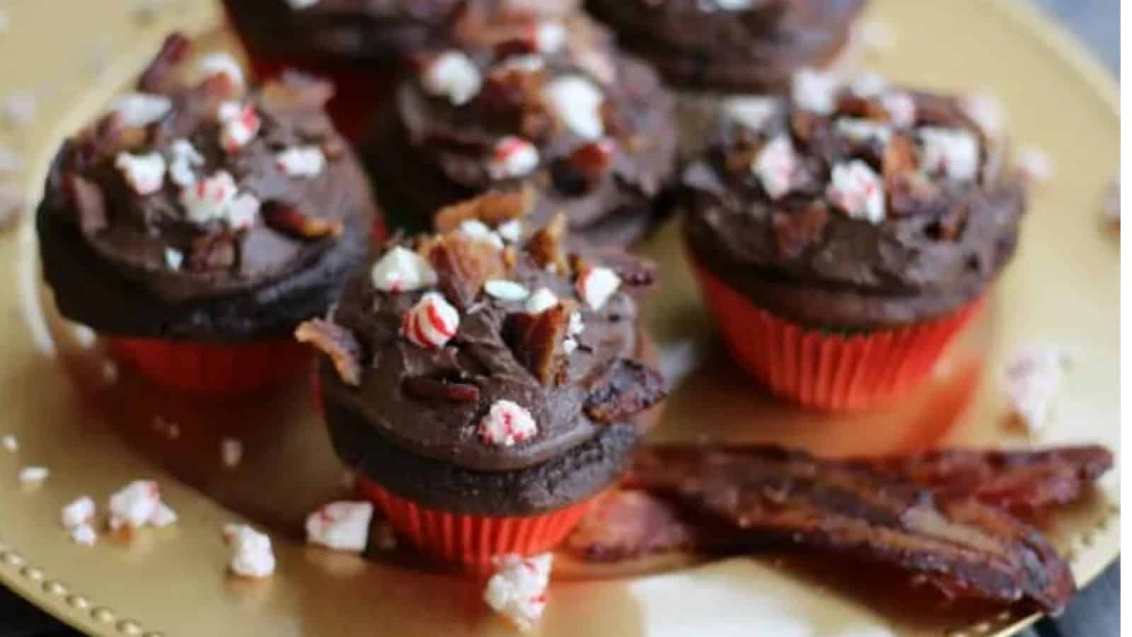 Gold plate with cupcakes, peppermint, and candied bacon pieces.