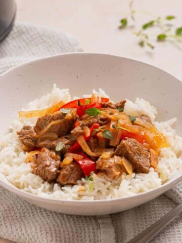 A bowl of Slow Cooker Pepper Steak.