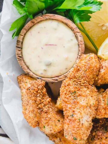 An overview of Air Fryer Fish Sticks with a dip and some slices of lemon.