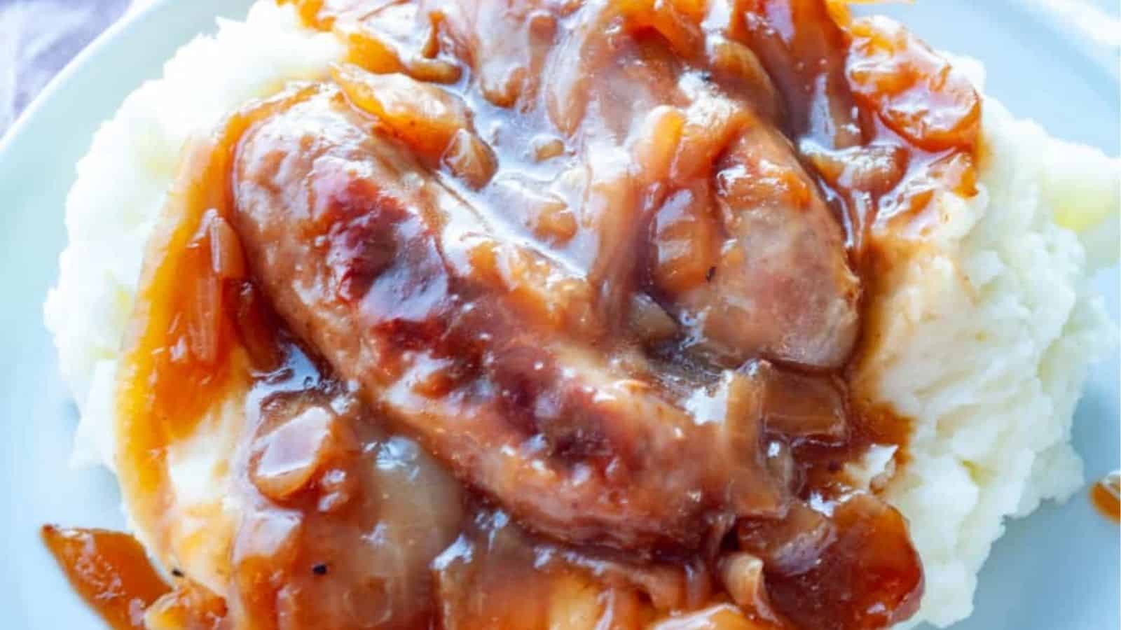 Close-up image of bangers and mash on a plate.