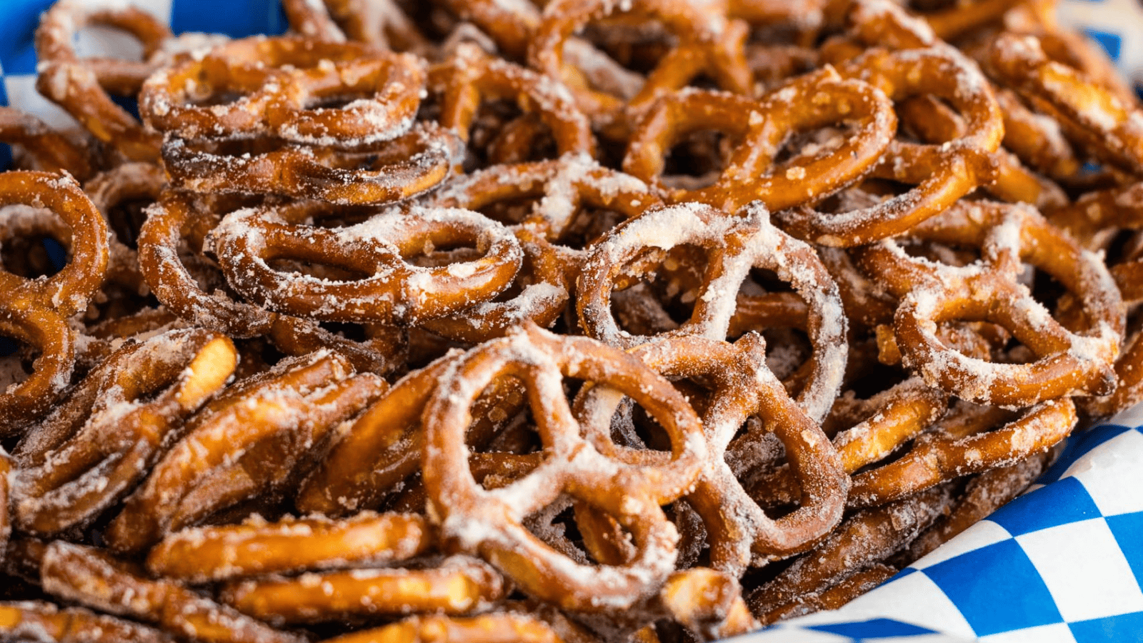 A pile of pretzels on a white plate.