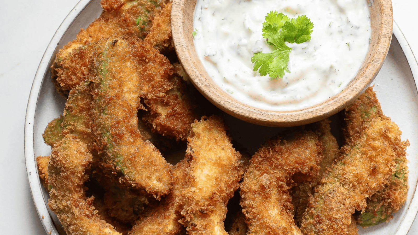 Fried avocado on a plate.