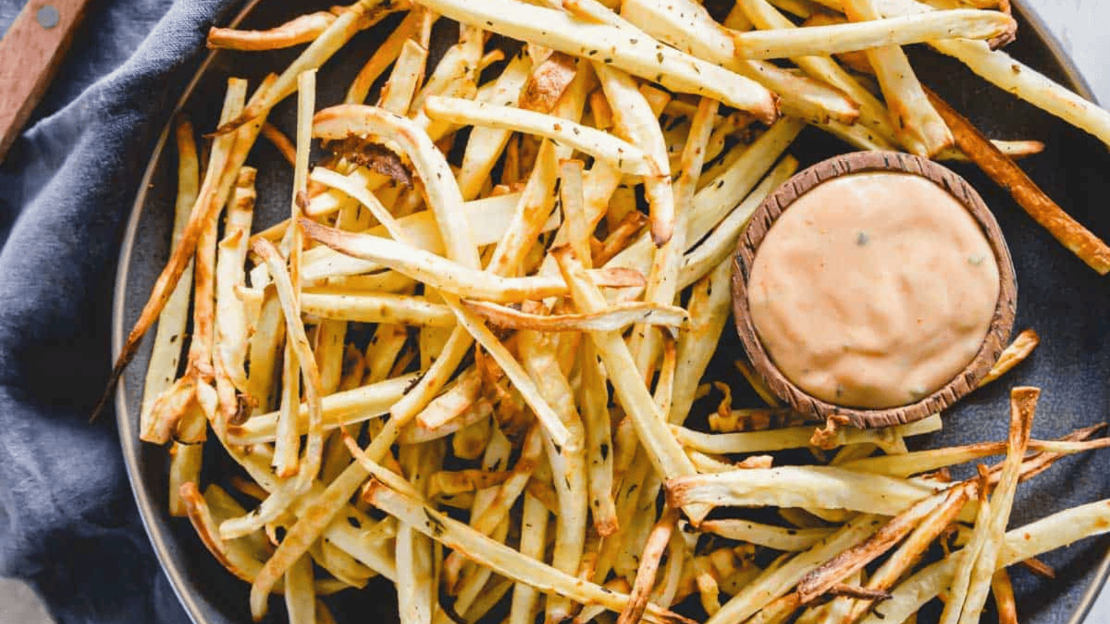 This image has an empty alt attribute; its file name is Rosemary-Garlic-Parsnip-Fries.png
