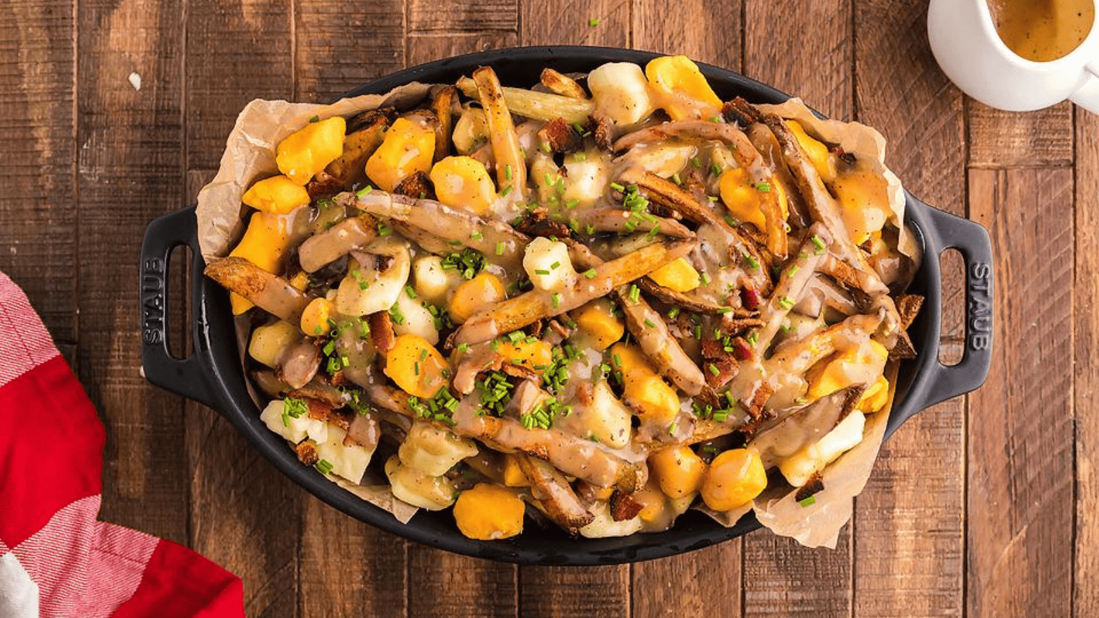 This image has an empty alt attribute; its file name is Smothered-Fries-with-Cheese-Curds-Bacon-and-Gravy.png