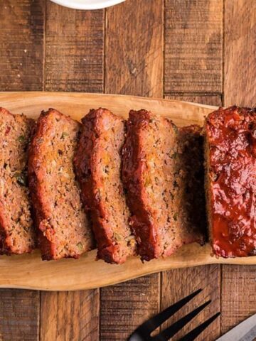 Top view of BBQ Smoked Meatloaf with Glaze on a wooden board.