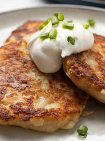 A close up image of Irish potato pancakes on a plate.