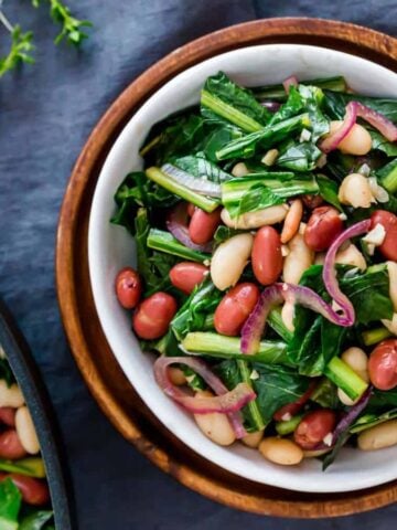An overview of a bowl of Dandelion Greens and Beans Skillet.