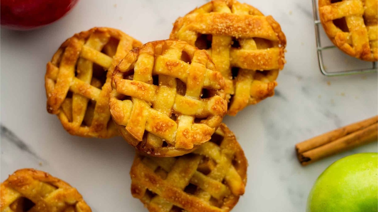 An overhead image of a stack of mini apple pies.