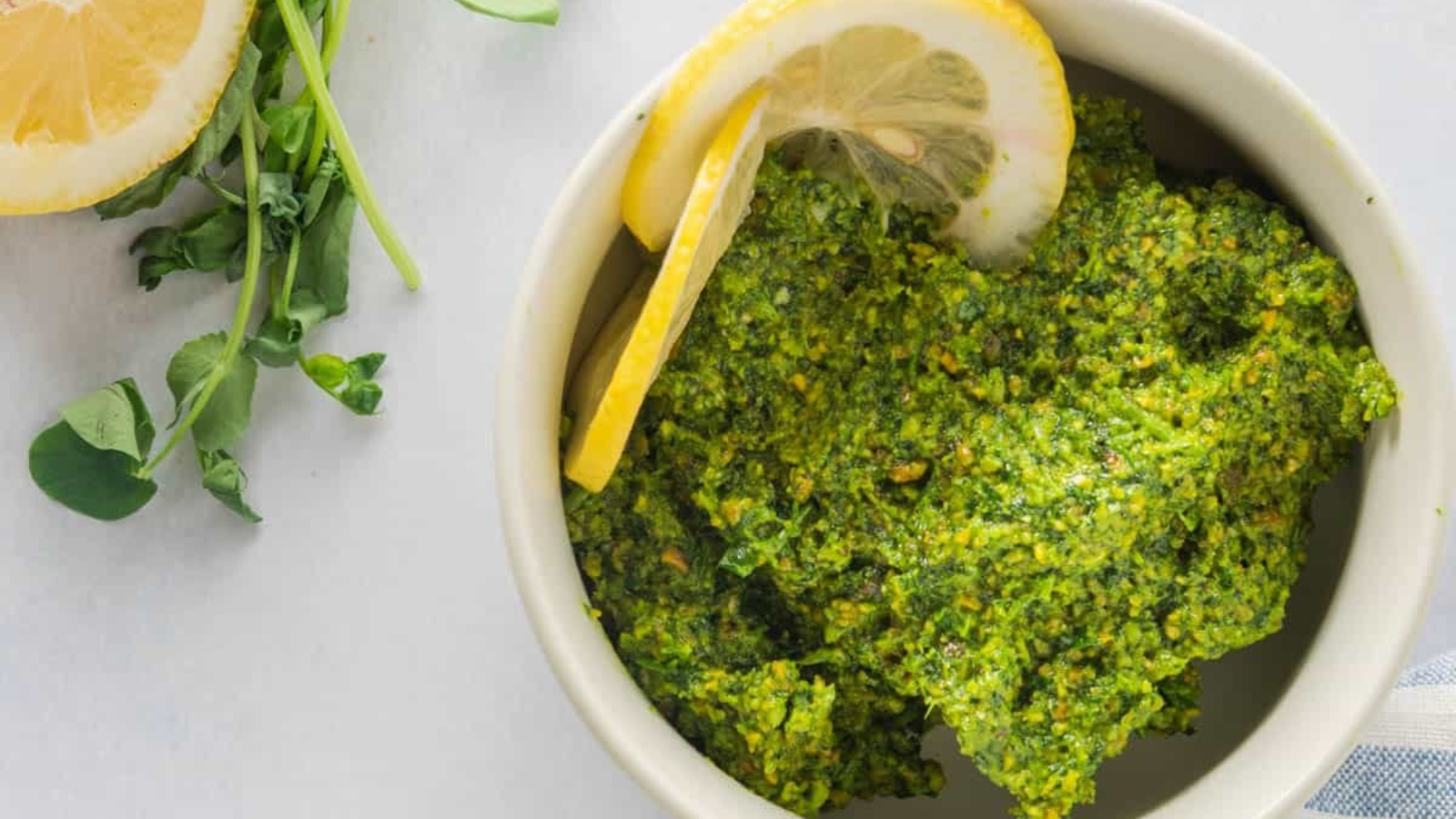 Pea Shoot Pesto in a white bowl.