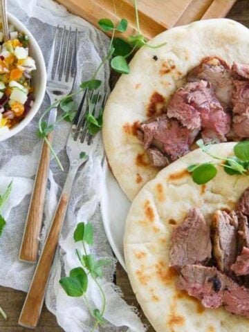 An overview of two Spring Gyros with a bowl of Apricot Salsa next to them.