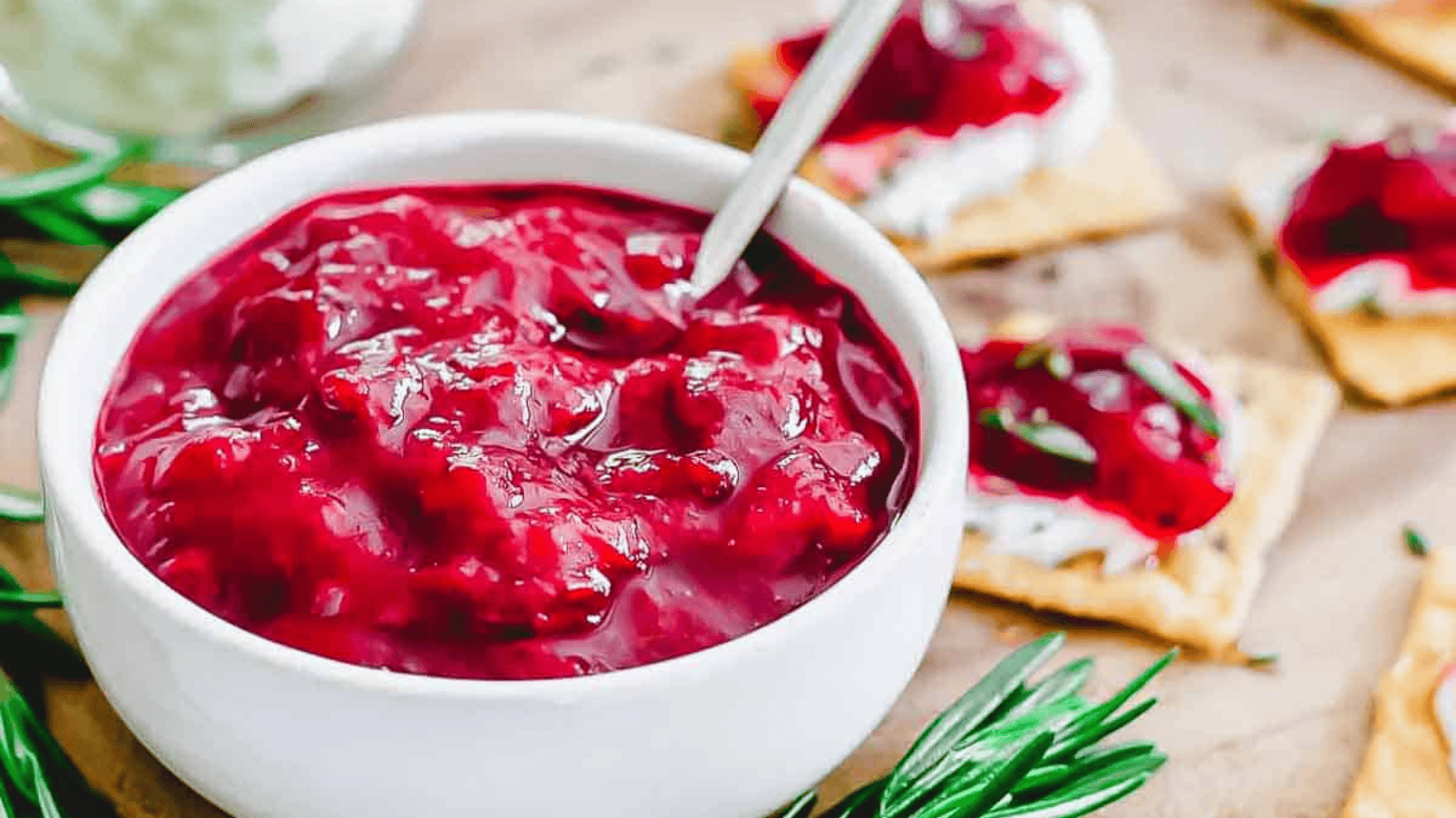 Chinese 5 spice plum jam in a white bowl with a small spoon.