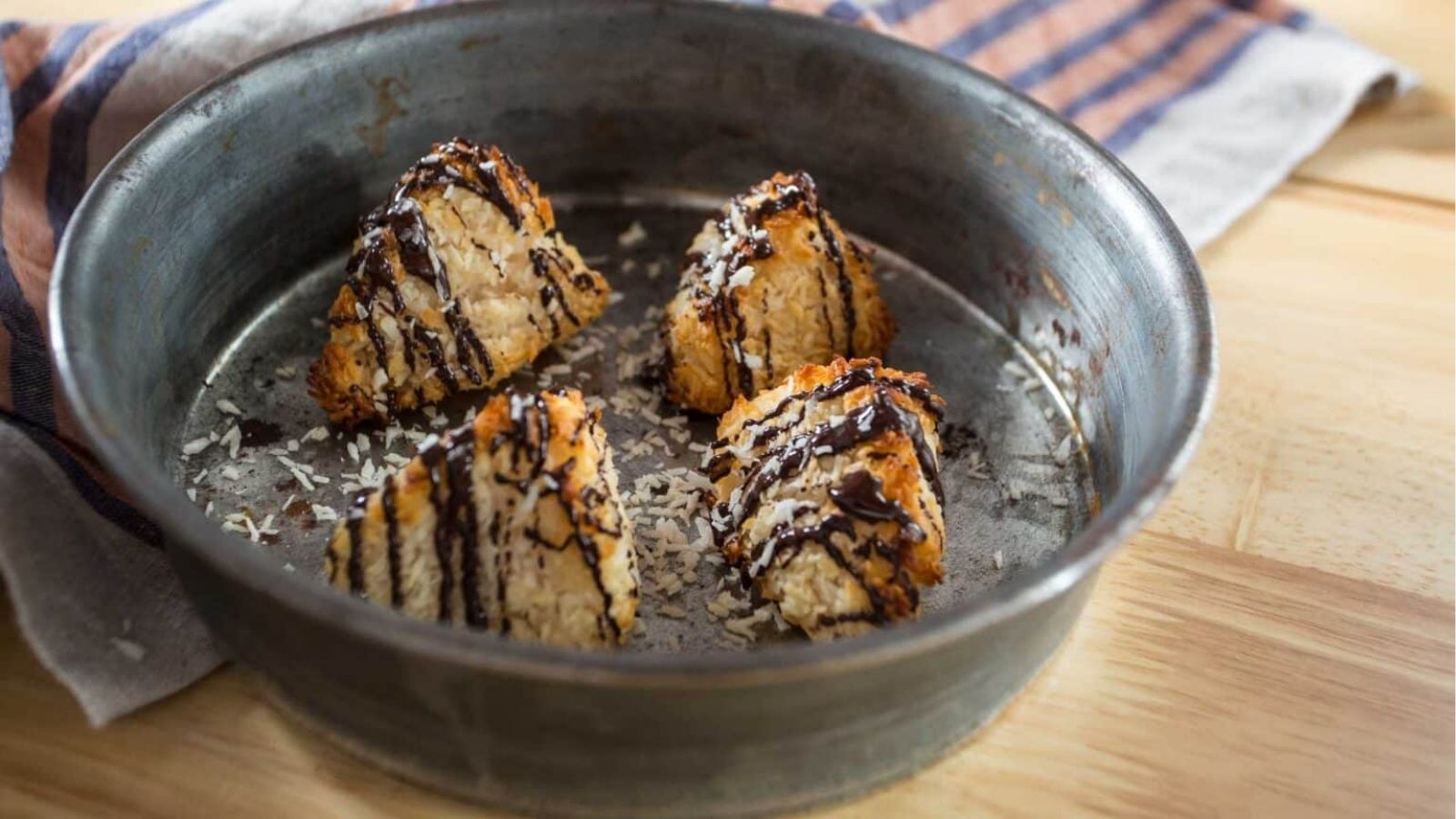 Close-up image of Coconut macaroon pyramids in a bowl.