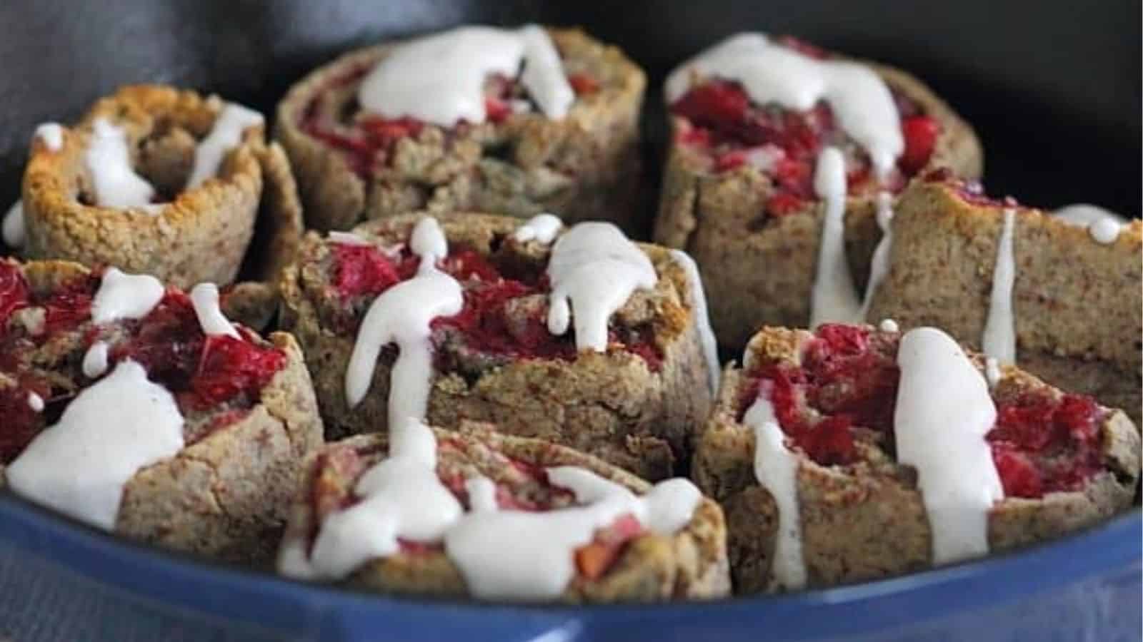 Cranberry cherry cinnamon rolls in a pan.