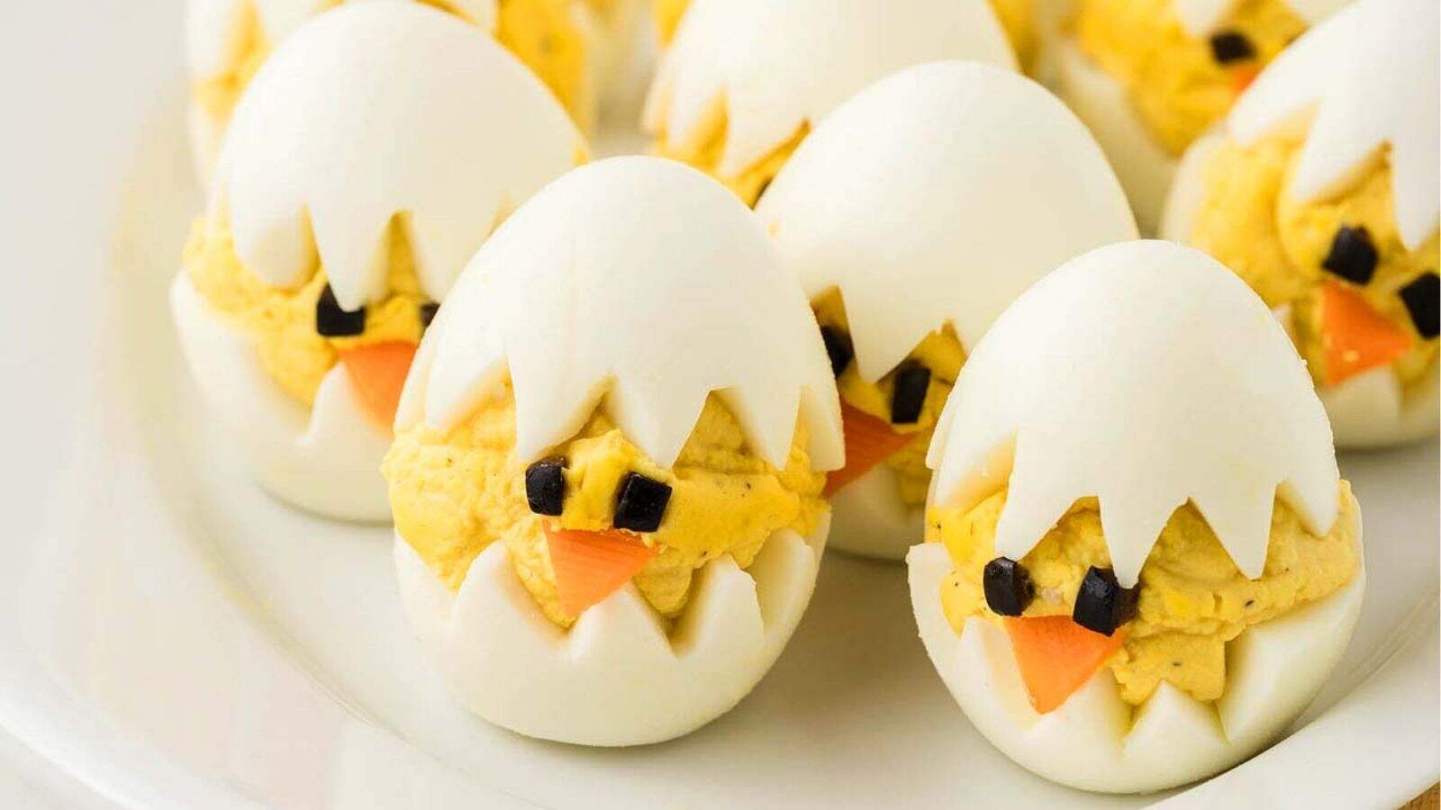Close-up image of deviled egg chicks on a plate.