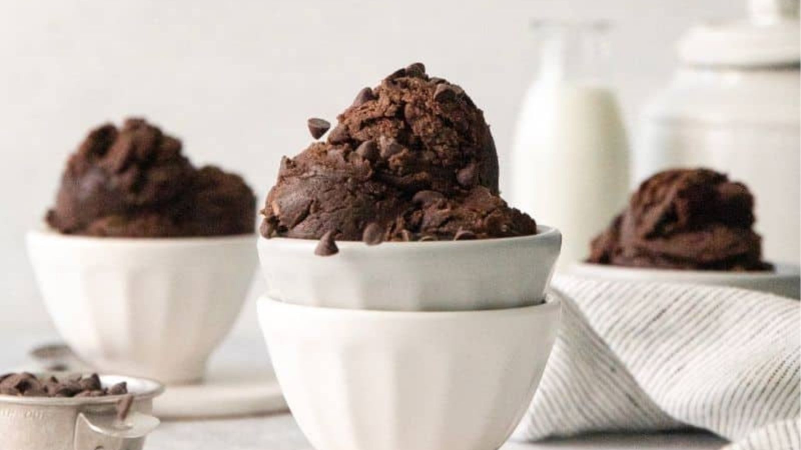Close-up image of edible brownie batter in bowls.